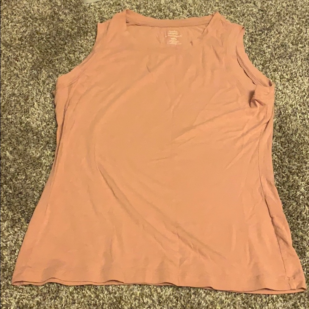 A sleeveless nudeish tank top